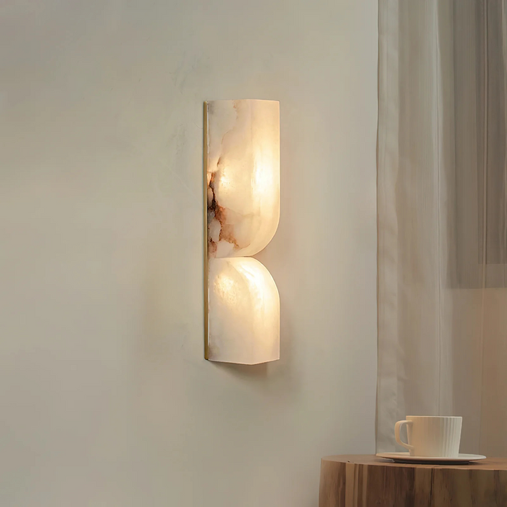 Sculptural wall lamp in alabaster with accents in Japandi brass