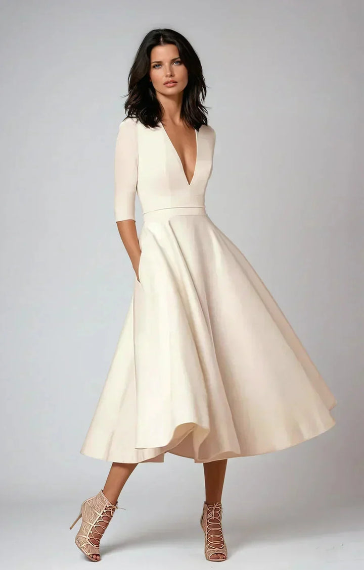 Daphne - Flared midi dress with V-neck, 3/4 sleeves and pockets