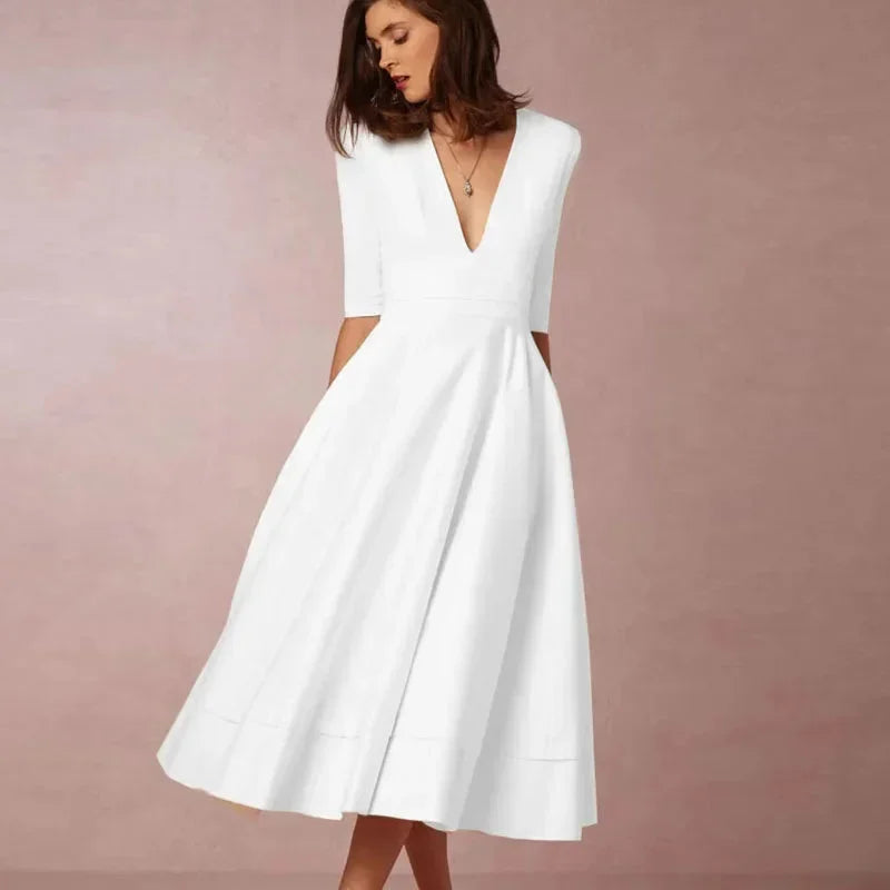 Daphne - Flared midi dress with V-neck, 3/4 sleeves and pockets
