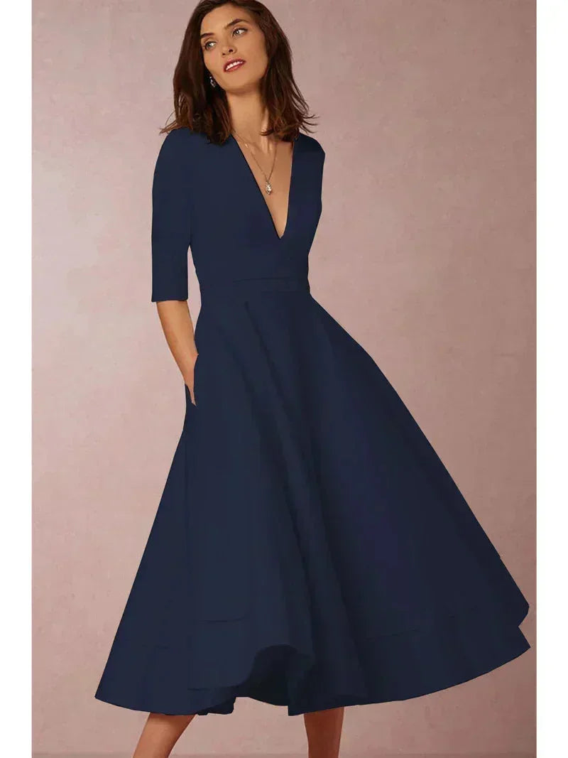 Daphne - Flared midi dress with V-neck, 3/4 sleeves and pockets