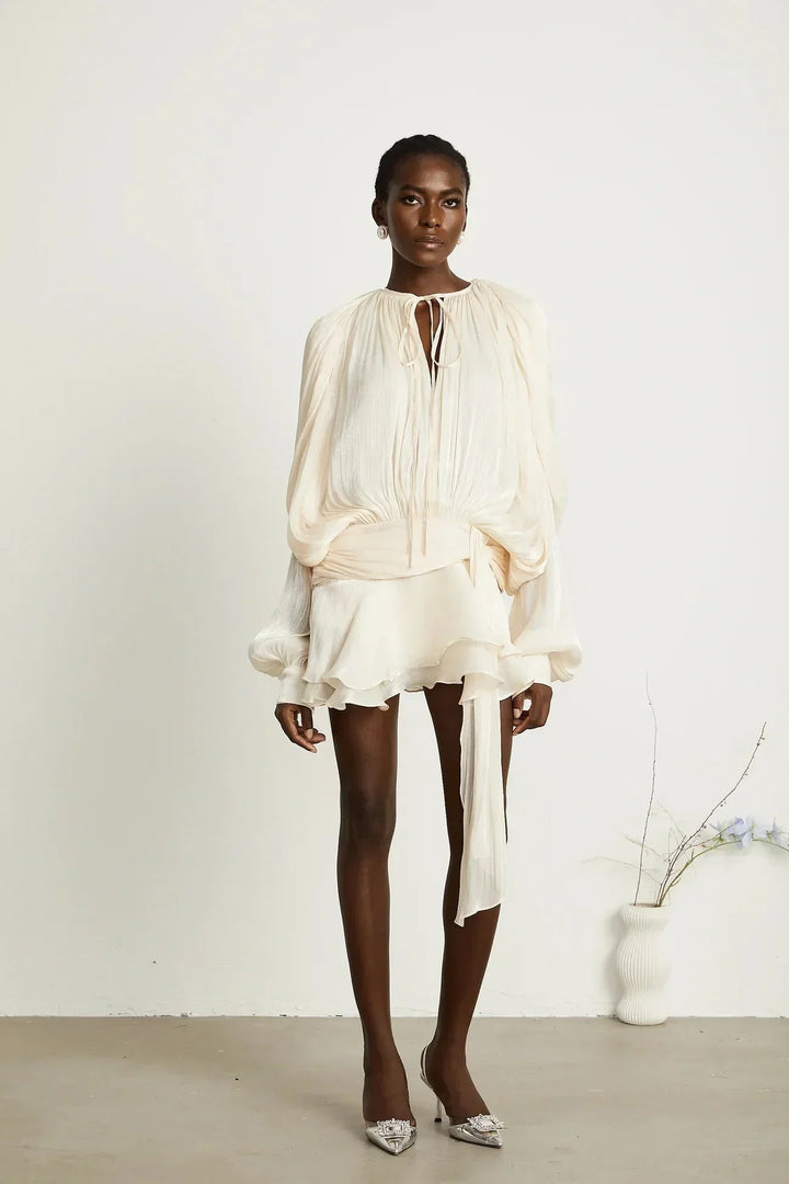 Deborah - Short flowing dress with long sleeves and a tied belt