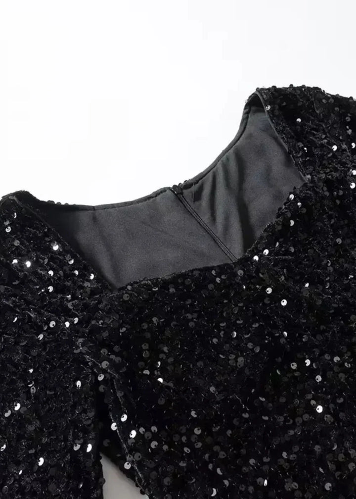 Women's black sequined mini dress with sweetheart neckline and long sleeves