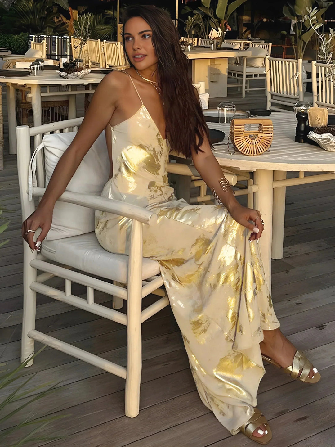 Women's gold satin maxi dress with foil details and straps