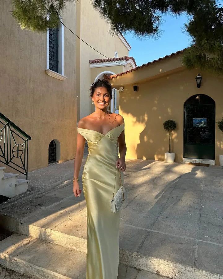 Women's off-shoulder yellow maxi dress with matching clutch