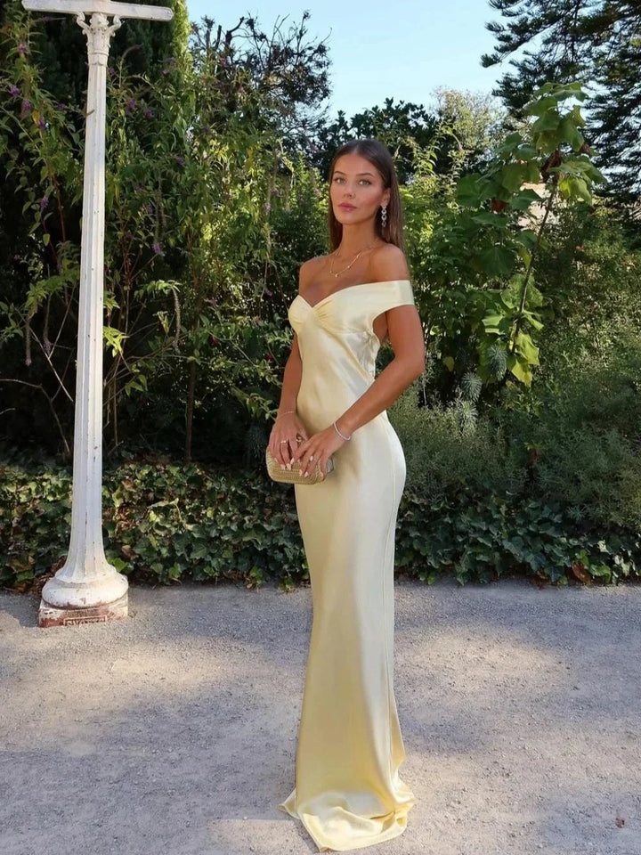 Women's off-shoulder yellow maxi dress with matching clutch