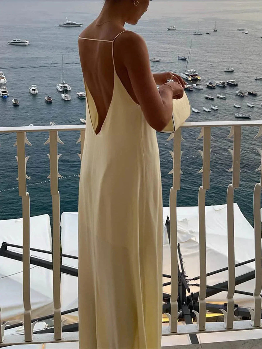 Women's yellow backless maxi dress with sleek straps
